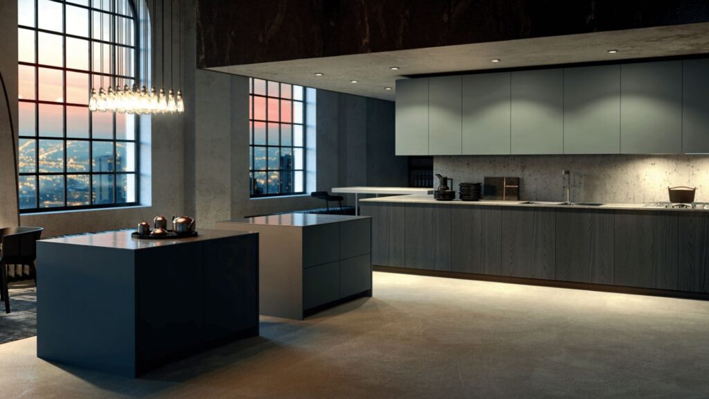 Cocina contemporánea con isla central, acabados mate y gran ventanal con vistas urbanas al atardecer.